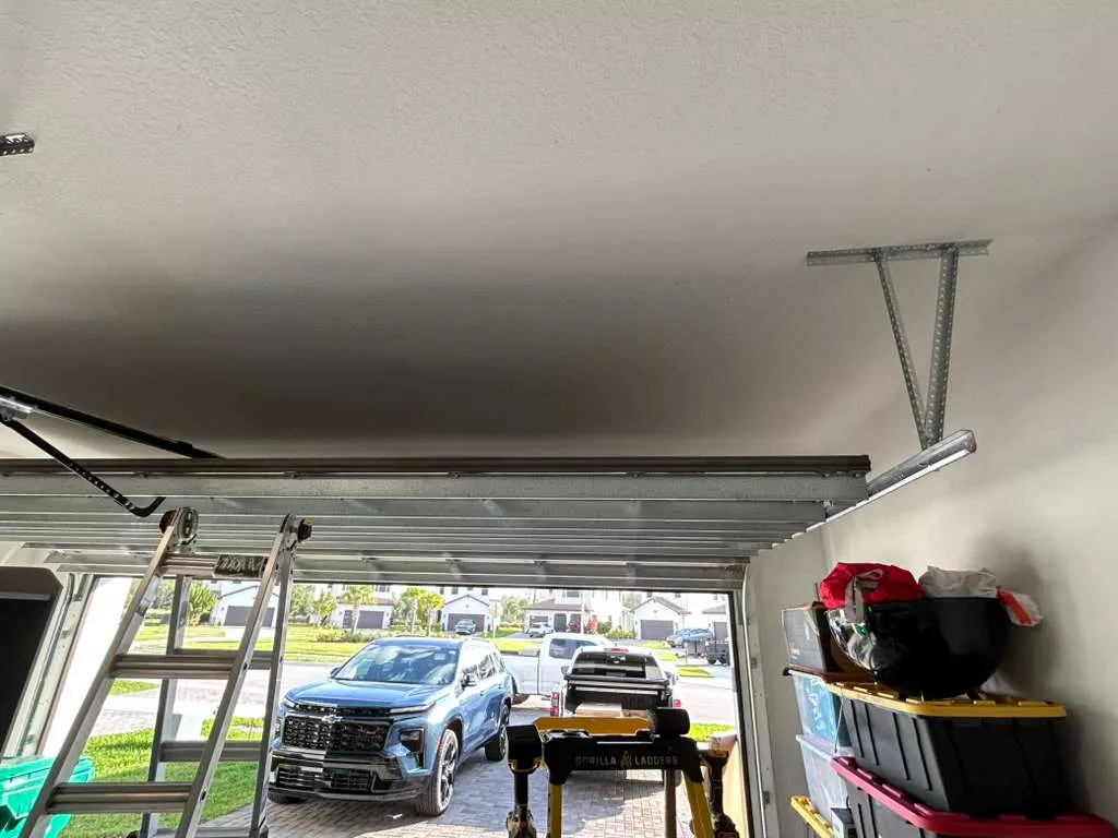 Steel overhead storage system in organized Florida garage