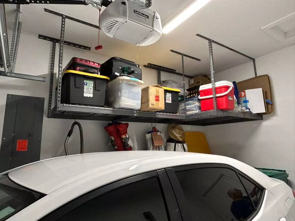 Garage organization with overhead storage racks - A&R Solutions Racks SW Florida