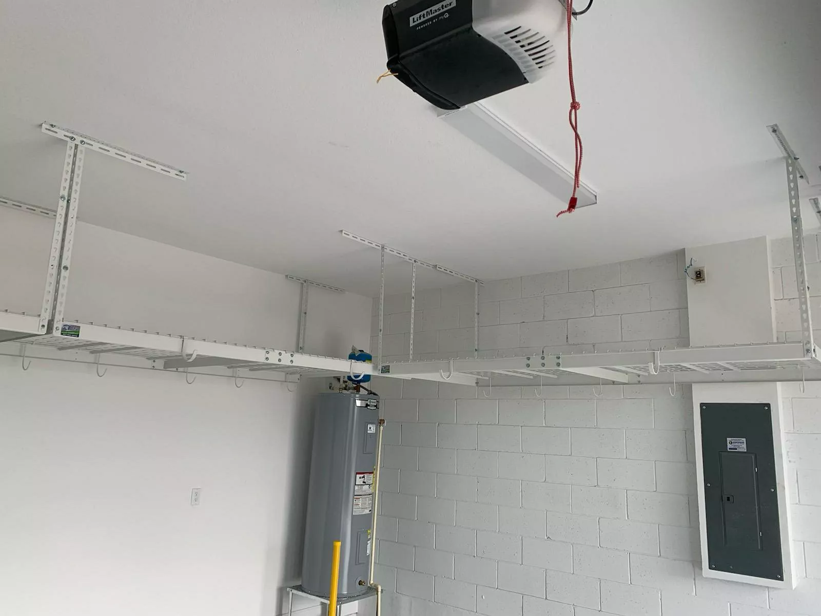 White overhead rack for garage storage - Naples FL installation